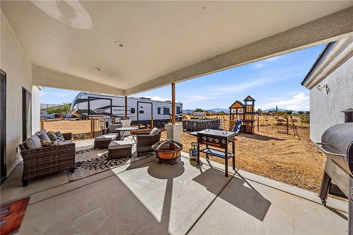 Covered patio overlooking the yard and desert landscape